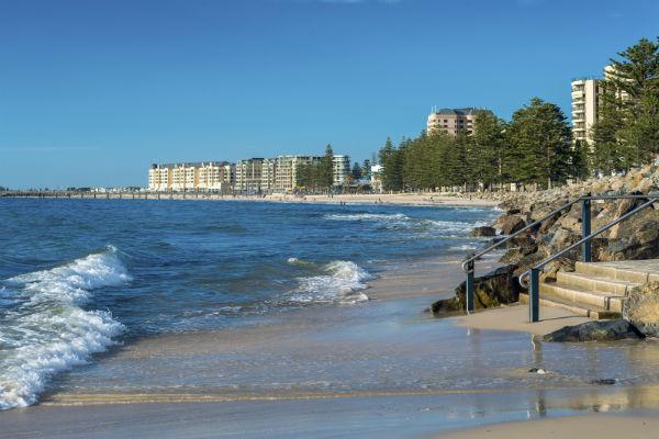 If you catch a sunny day in Adelaide, head down to the golden sands of Glenelg Beach.